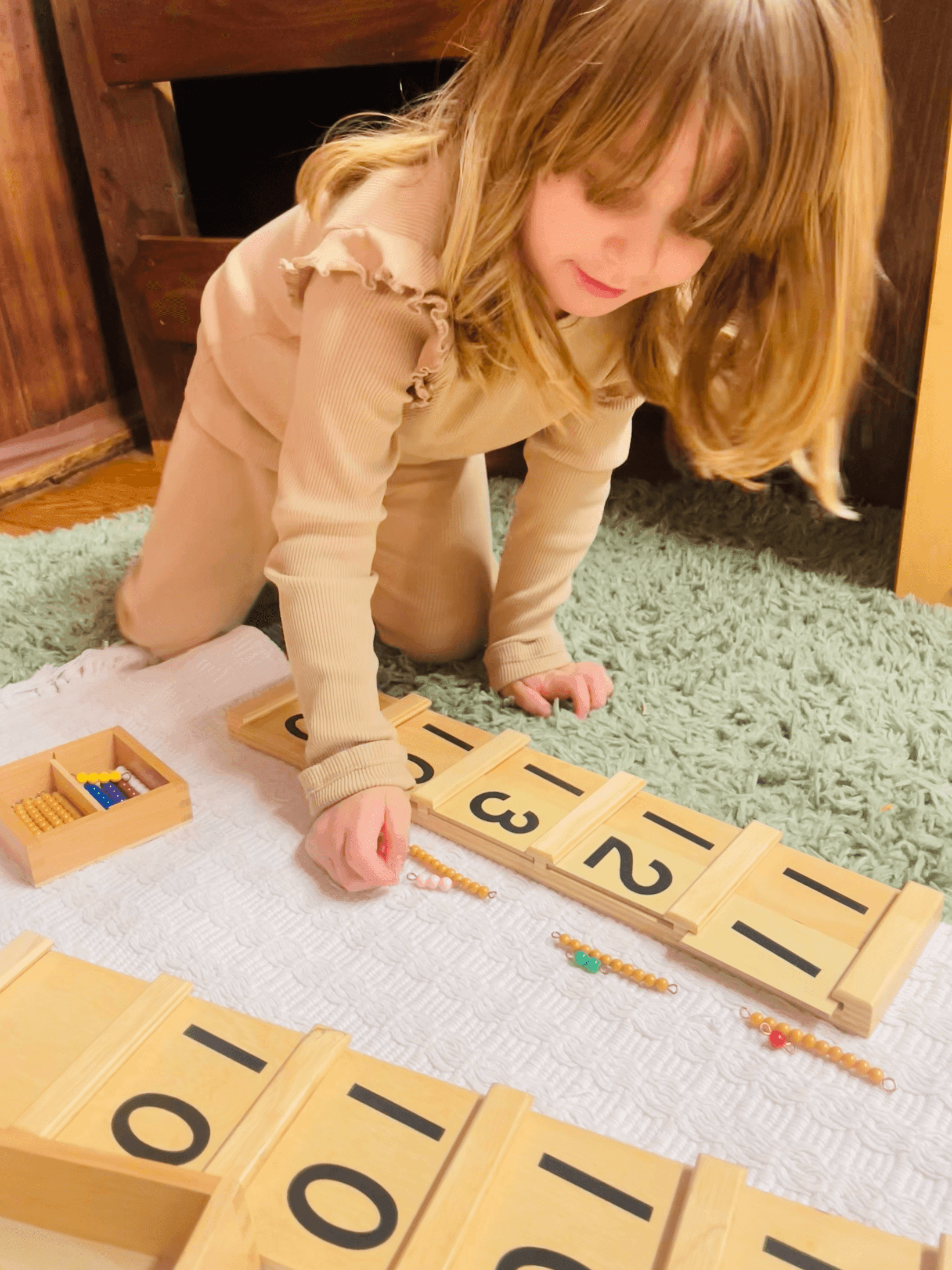 Child working with Montessori number materials