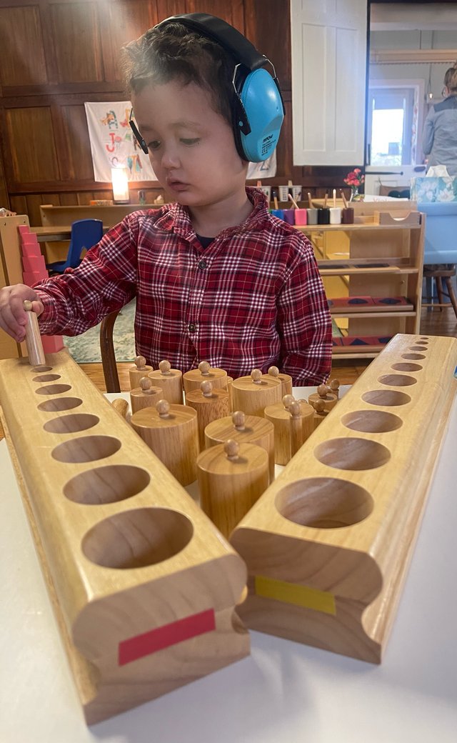 Students helping each other learn at Spicebush Montessori School